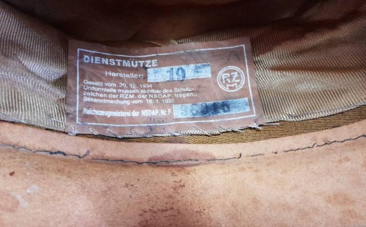 NSDAP SCHIRMMUTZE KREISLEITER (Leader di Distretto). TARGHETTA ‘RZM’.